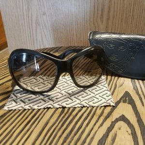 black Versace glasses with a madusa on the sides